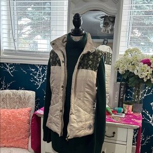 Hooded Cream Puffer Vest with Green Patterned Yoke and Faux-Fur Trim,